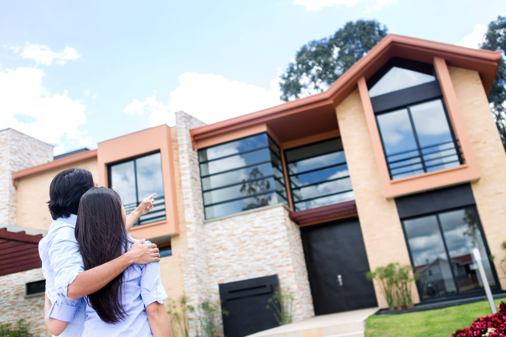 Couple looking at a beautiful house to buy Couple looking at a beautiful house to buy